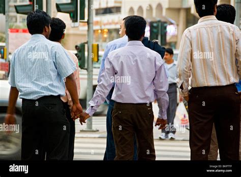 Men holding hands Dubai Stock Photo - Alamy