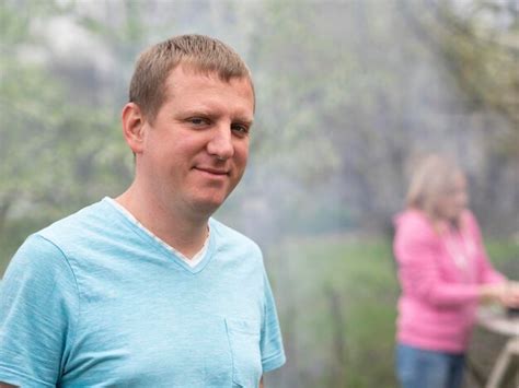 Premium Photo Portrait Of Smiling Mid Adult Man Standing Outdoors