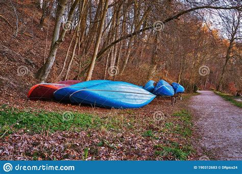 Blue Canoes On The Shore Of The Bow River In Banff National Park Stock