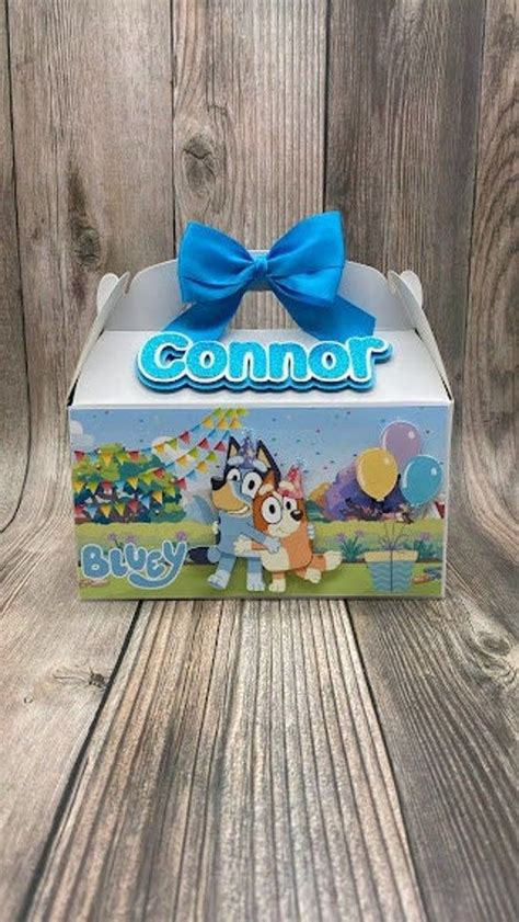 An Unopened Box With A Blue Bow On It