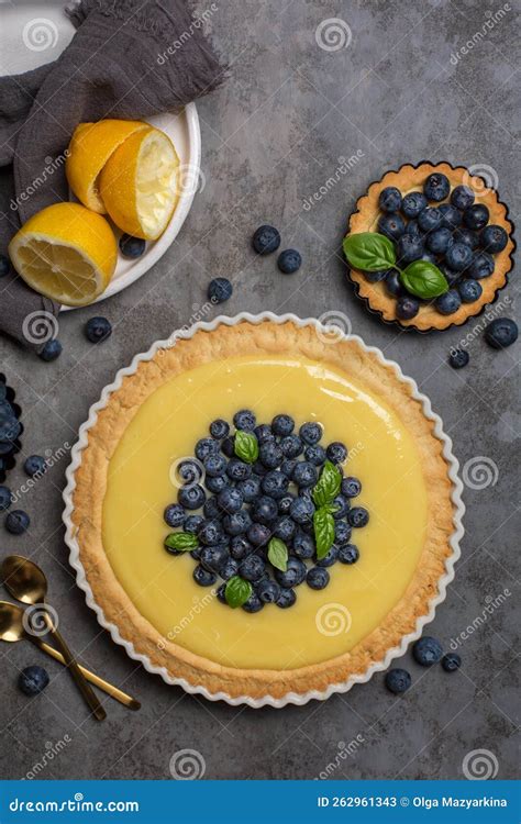 Blueberry And Lemon Curd Tart On Dark Grey Stone Table Stock Image