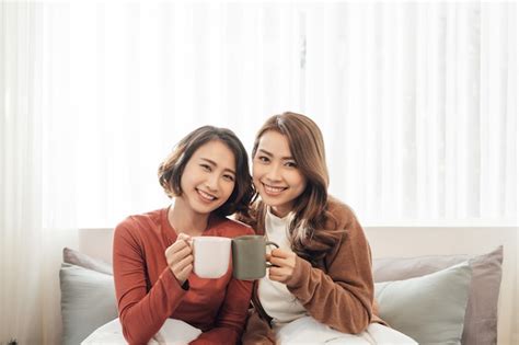 Premium Photo Happy Friends Talking And Drinking Coffee And Tea