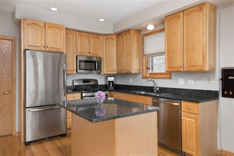 Black Granite Countertops With Honey Oak Cabinets