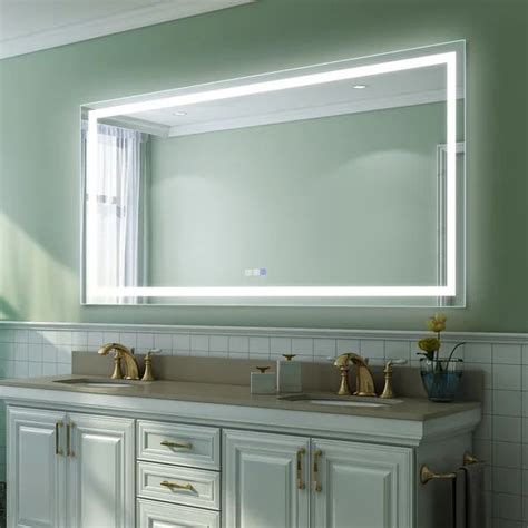 a bathroom with two sinks and a large mirror