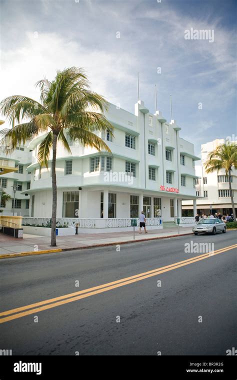 Old car parked on front of the art deco Carlyle Hotel on Ocean Drive in ...