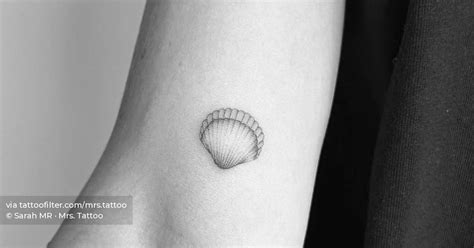 Illustrative style shell tattoo placed on the inner