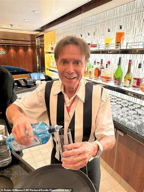 Sir Cliff Richard Soaks Up The Sun And Enjoys A Cocktail While Posing