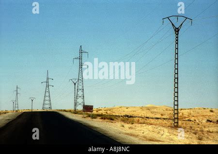 Electric Pylone Lines In The Desert Algeria Stock Photo Alamy