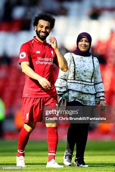 Mohamed Salah Of Liverpool And His Wife Magi Walk On The Pitch After