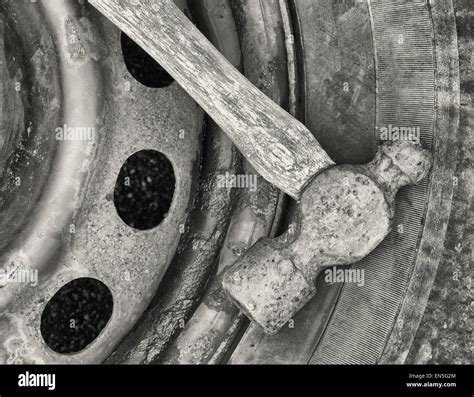 Old Ball Peen Hammer On Wheel And Tire Black And White Image Stock