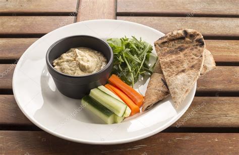 Hummus with crudites & wholemeal pitta Stock Photo by ©chef.photography 107070332