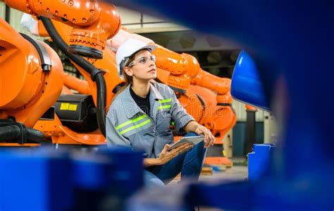 Female Engineer Worker Working With Robotic Machine Automation Stock