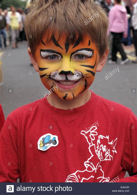 Boy With Face Painted As A Tiger Stock Photo In 2021 Tiger Face