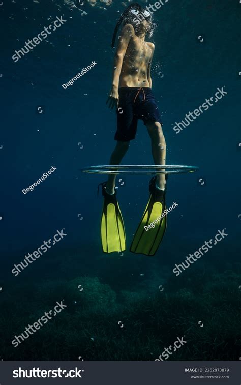 Below Unrecognizable Shirtless Diver Flippers Snorkeling Stock Photo