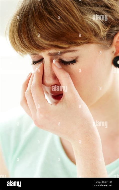 Girl with blocked sinuses Stock Photo - Alamy