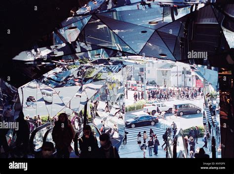 Mirror Filled Entrance Of Busy Shopping Mall In Harajuku Japan Stock