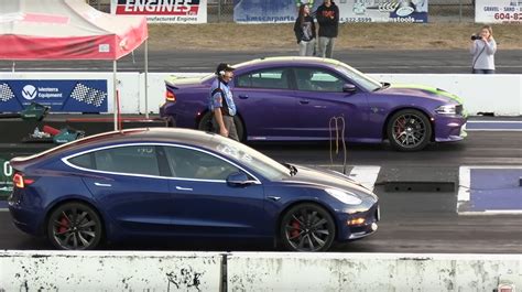 Dodge Charger Hellcat And Tesla Model 3 Drag Race Turns Up The ICE Vs