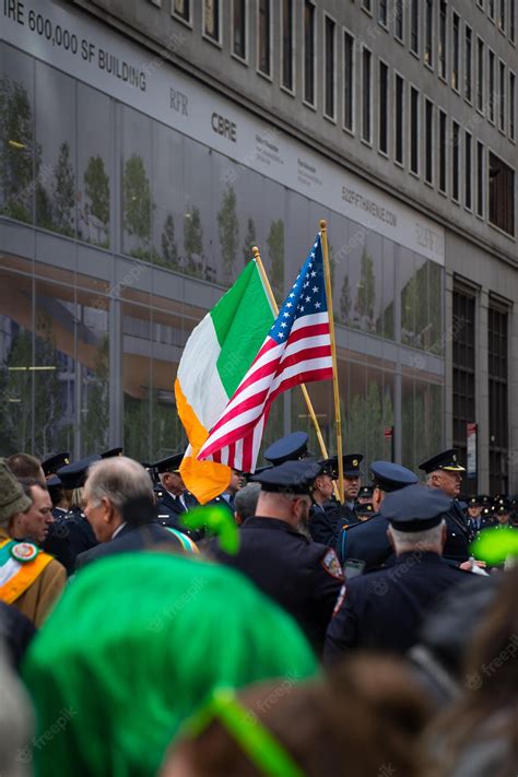 Premium Photo A Man In A Police Uniform Is Holding A Flag And A Green