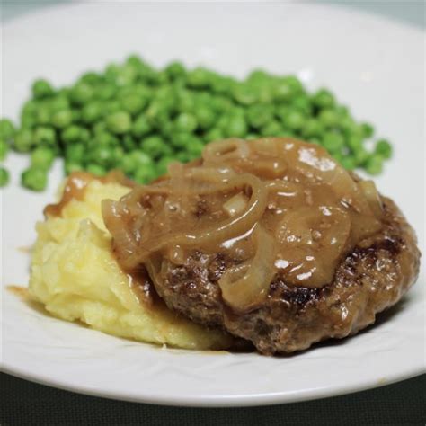 Hamburger Steak With Onions And Gravy Photos