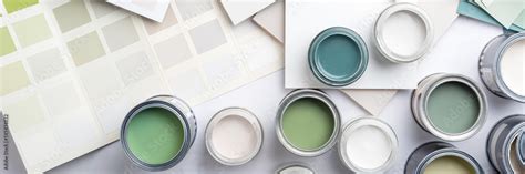 Tiny sample paint cans during house renovation, process of choosing ...