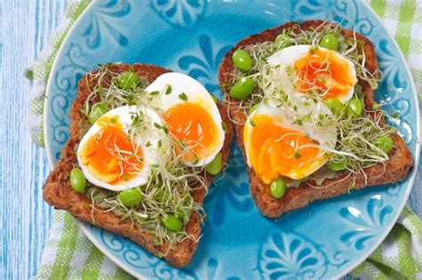 Premium Photo | Avocado and egg whole wheat toast with edamame