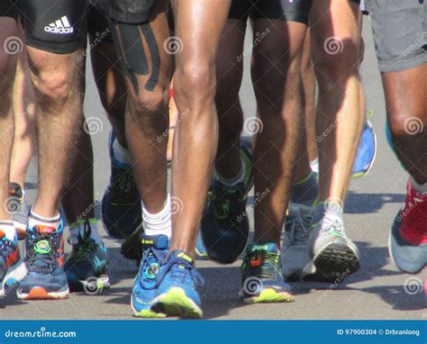 A Close Up Of Runners Legs In Road Running Race Editorial Stock Image