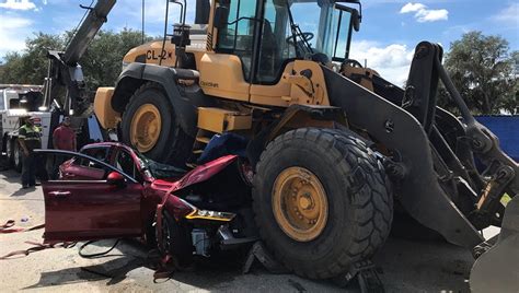 77 Year Old Florida Woman Killed After Front End Loader Backs Over Car