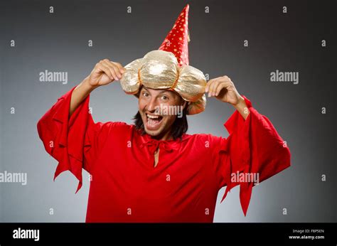 Funny wizard wearing red dress Stock Photo - Alamy