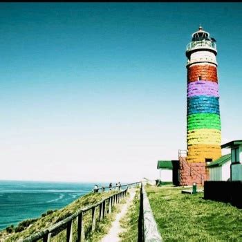 Solve RAINBOW LIGHTHOUSE Jigsaw Puzzle Online With 64 Pieces