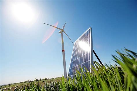 Solar Panel And Wind Turbine Photograph By Claire Deprezreporters