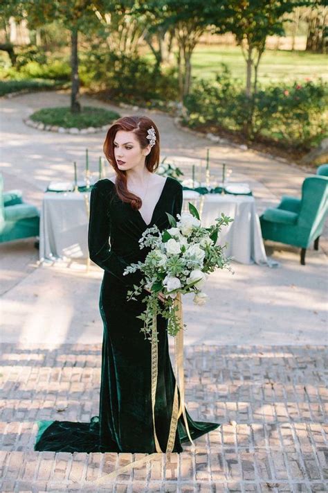 An Emerald Velvet Wedding Dress With A Deep V Neckline And Long Sleeves