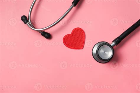 Heart shaped symbol and stethoscope on pink background 2183247 Stock ...