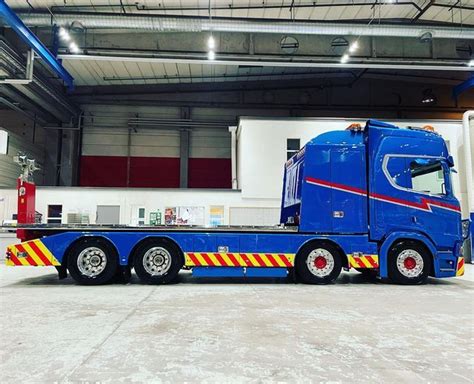 A Large Blue Truck Parked Inside Of A Building