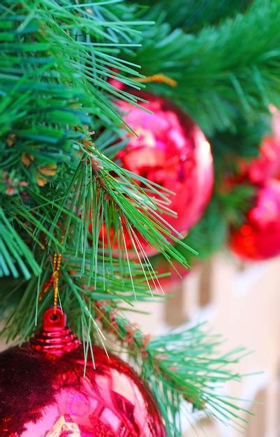 Premium Photo Christmas Tree With A Bunch Of Shiny Red Balls Ornaments