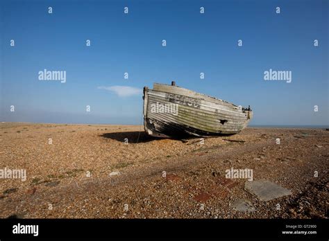 A Derelict Wooden Fishing Boat On A Shingle Beach Stock Photo Alamy