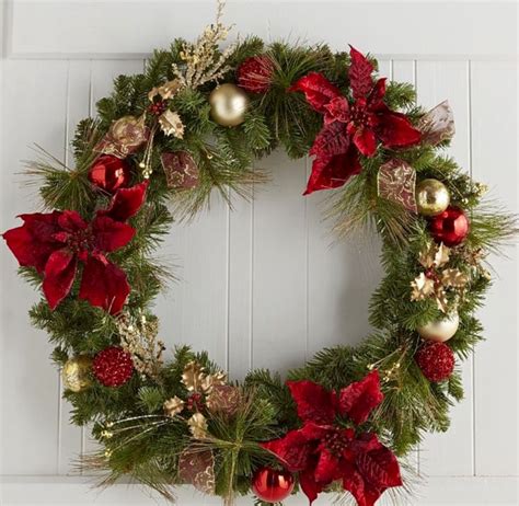 Christmas Wreath With Poinsettias And Pine Cones