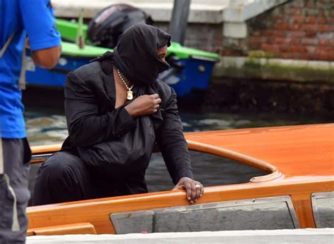 Kanye West was caught exposing his bare bottom during an Italian boat ride with "wife" Bianca ...