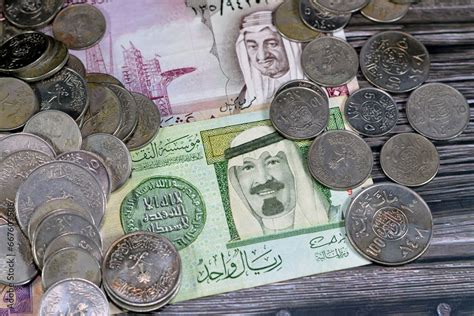 Saudi Arabia riyals money banknote bills and coins of different eras ...