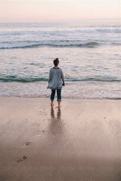 «woman In The Waves At The Beach Del Colaborador De Stocksy «simone