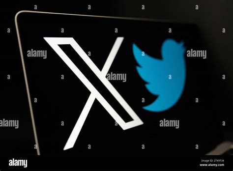 X Social Media Platform Logo With Old Twitter Bird Logo Seen On Laptop