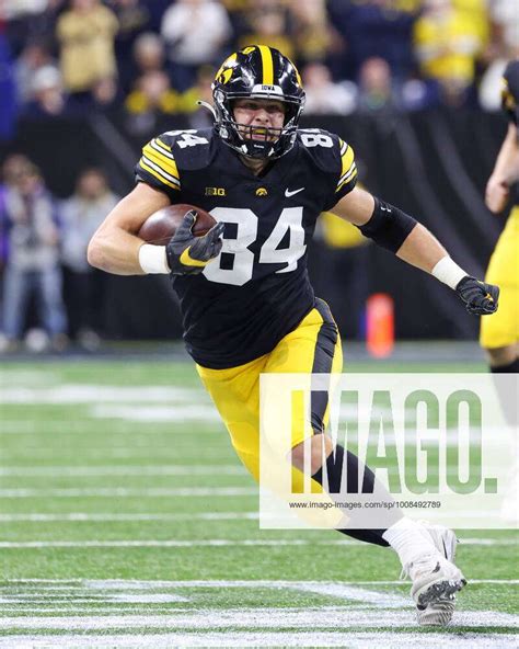 December 04, 2021: Iowa Hawkeyes tight end Sam LaPorta (84) runs after ...