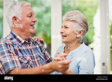 Happy senior couple dancing Stock Photo - Alamy