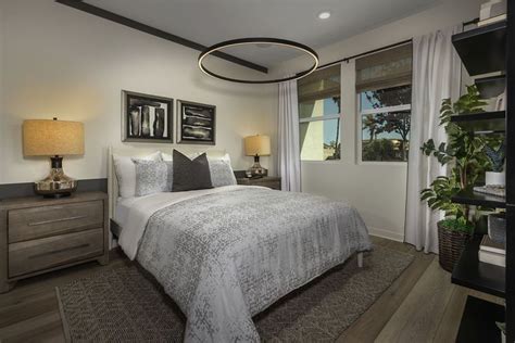 We love the addition of this modern lighting fixture in this bedroom ...