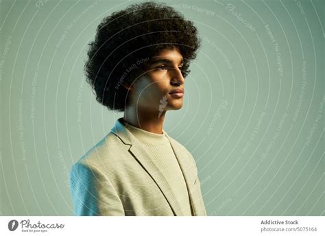 Stylish Hispanic man with Afro hairstyle - a Royalty Free Stock Photo ...