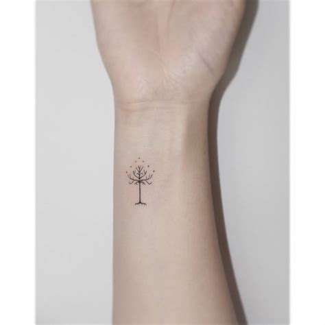 Minimalistic Style Leafless Tree Tattoo Done On The