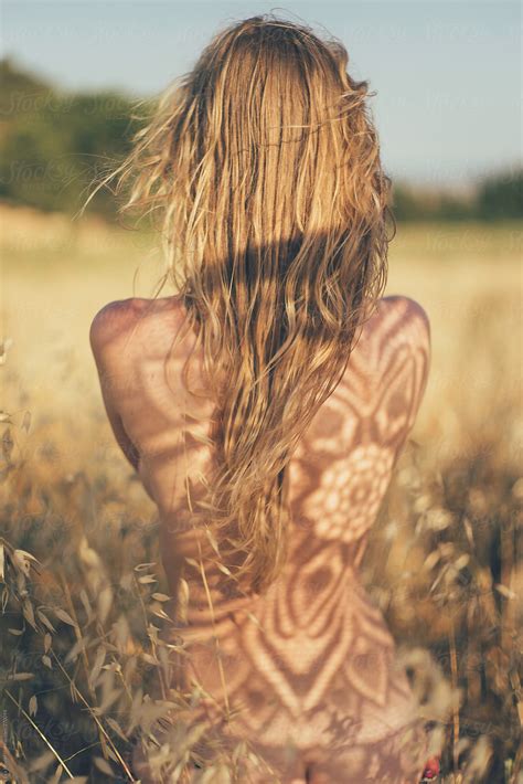 Beautiful Woman With A Flower Shaped Shadow On Her Naked Back Del