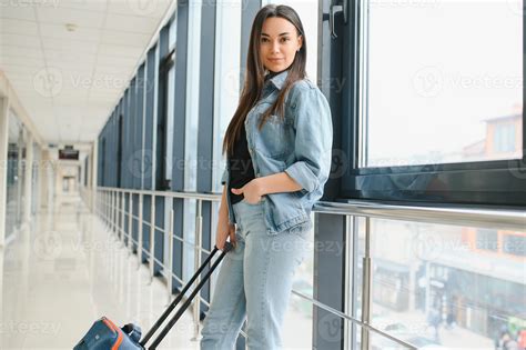 Cheerful attractive young woman travelling by world. 41903913 Stock