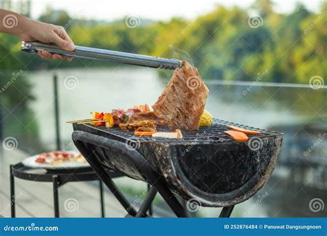 Delicious Grilled Meat With Smoke Bbq With Vegetables In Outdoor Barbecue Party Lifestyle