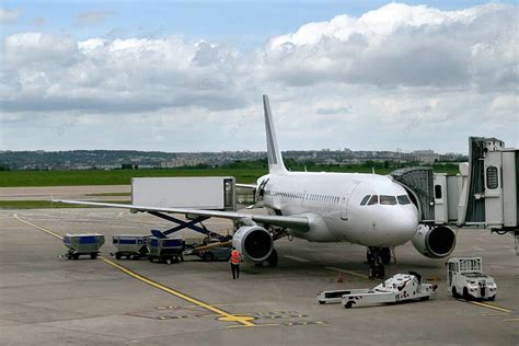 Plane Parked At The Airport Boarding Windows Aircraft Photo Background