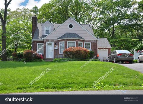 Suburban Brick Bungalow Cottage Home With Bay Window Stock Photo